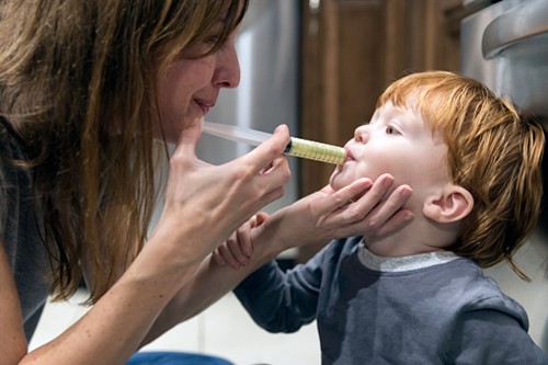 boy taking medication